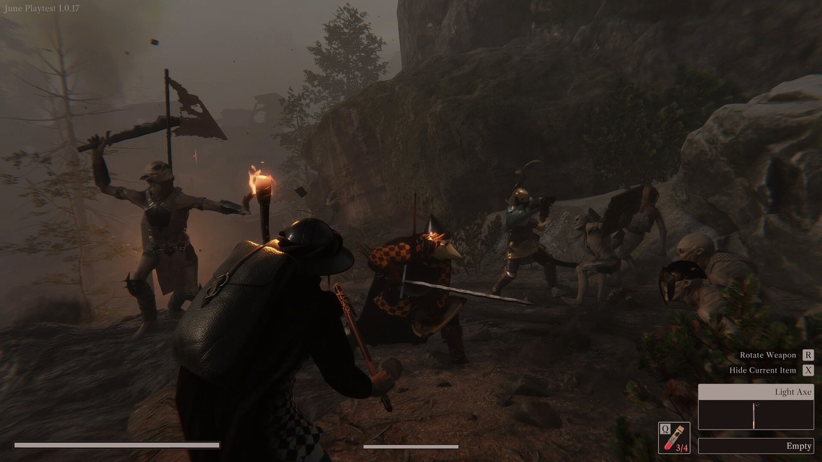 An armoured adventurer faces enemies beside a torch in the ruins.