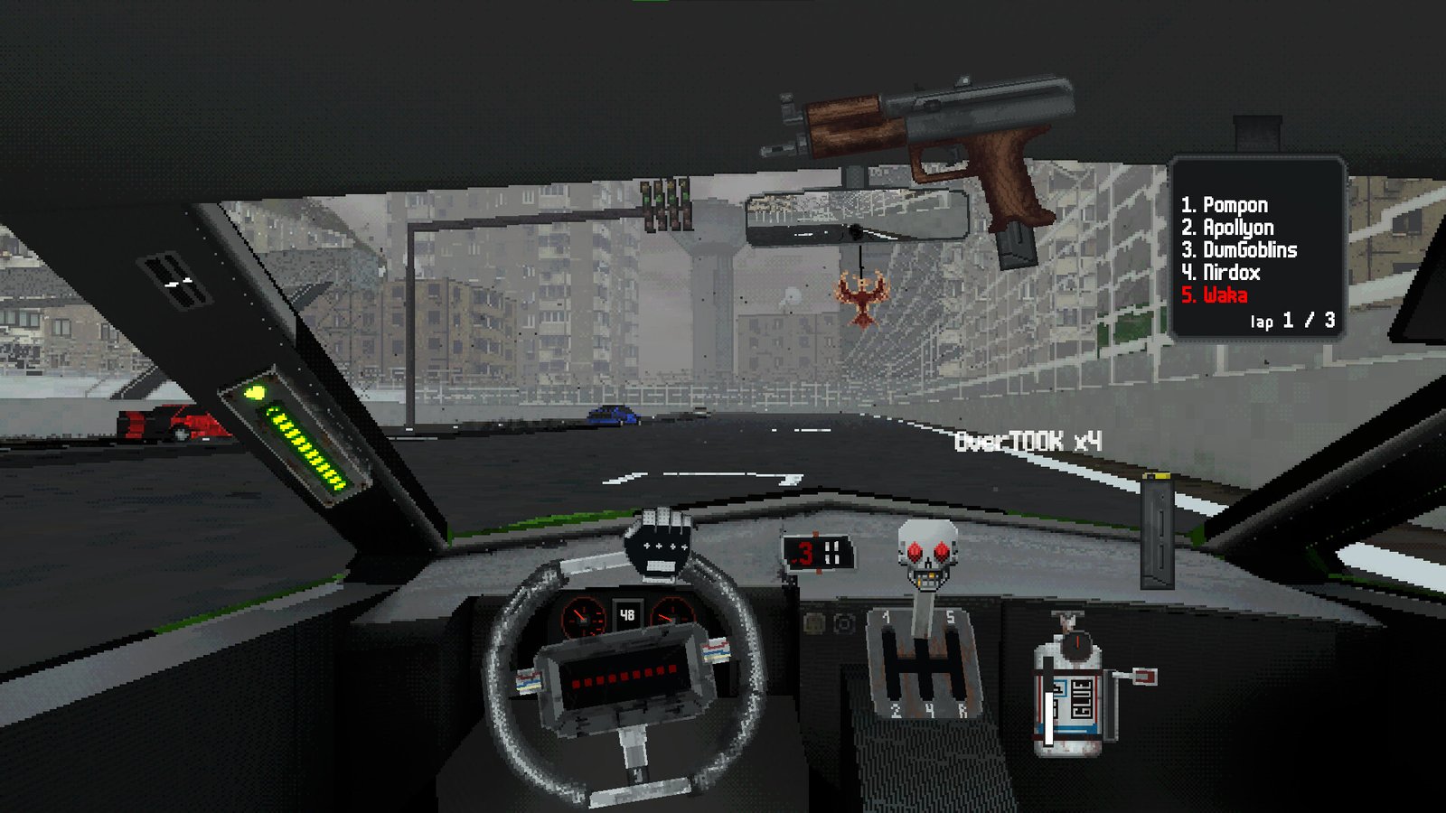 The driver holds a pistol above the steering wheel on a fenced track.